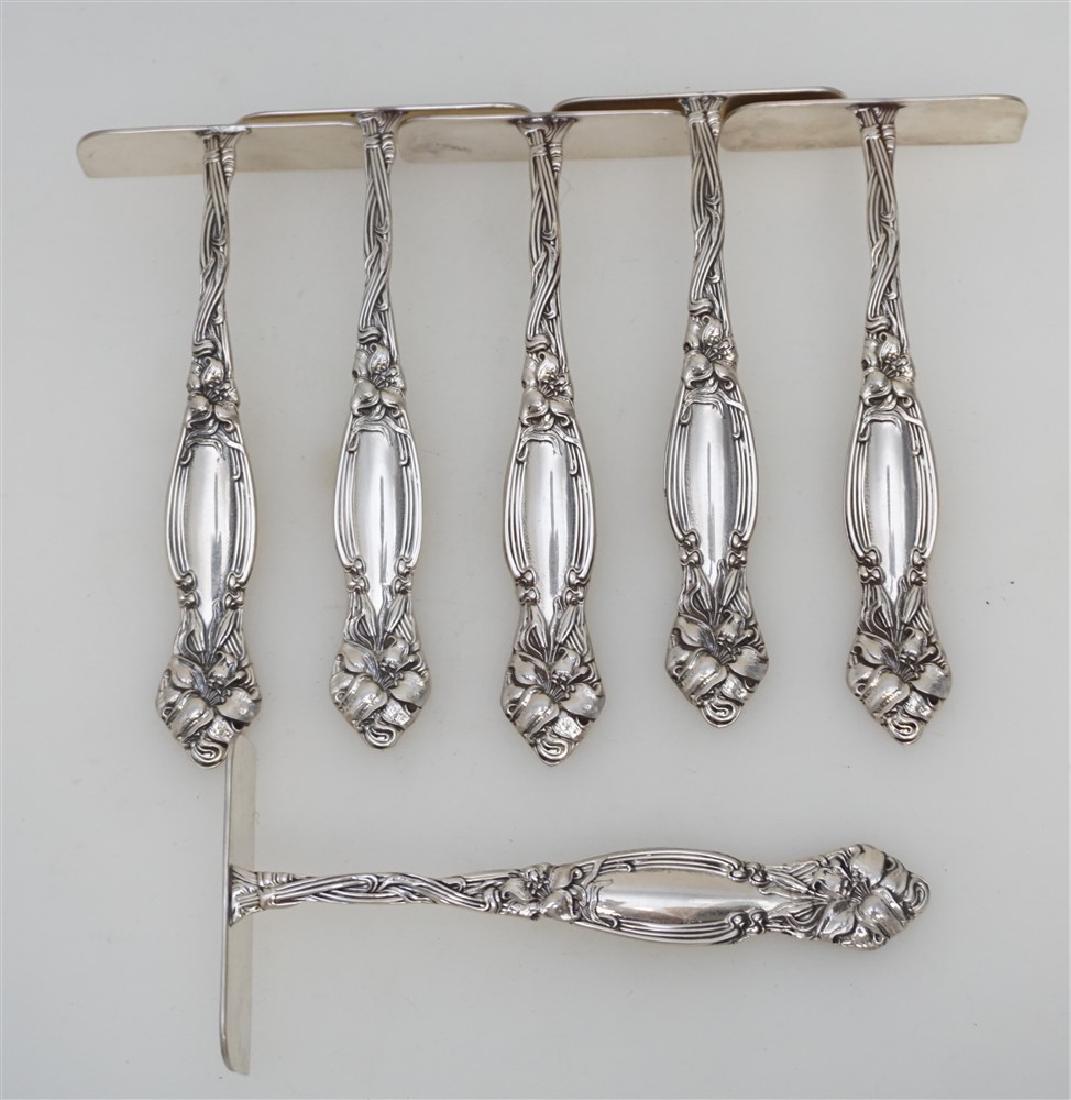 6 STERLING TIGER LILY FOOD PUSHERS: Six (6) American Sterling Easter Lily Food Pushers by Watson. Very good condition, no monograms. Each 4 1/4". Weight on all 160 grams. PROVENANCE: A Private Charleston SC Estate.