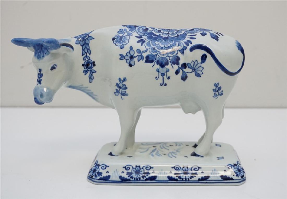 LARGE ROYAL DELFT COW: Large Vintage Royal Delft Cow raised on a rectangular base with canted corners. Good condition, measures 8" long and 6" tall. Entirely hand painted in Holland in the same workshop in production since 