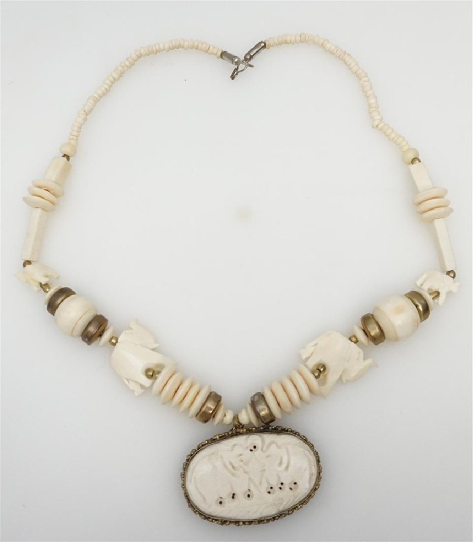 CARVED BONE ELEPHANT NECKLACE: Carved Bone Elephant Necklace with Pendant from India. The Elephants all have trunks raised for good Luck. Measures 22" opened. Pendant 1.50"x2.25". Weight 3.2 oz. PROVENANCE: A Charleston SC Private 