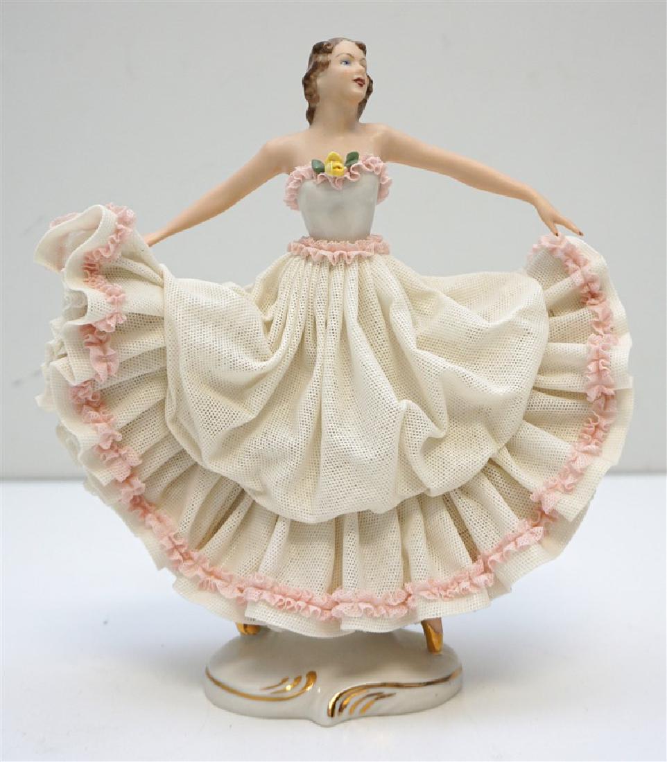 SANDIZELL DRESDEN LACE DANCER: Vintage Sandizell Larger Dresden Dancer c. 1960. Measures 8"x3 1/2"x8 3/4". Good condition but missing edge of ruffle on back. Weight 1 pd 7 oz PROVENANCE: A Charleston SC Private Estate