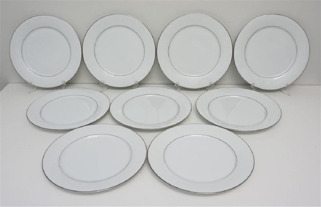 9 NORITAKE RANIER DINNER PLATES: Nine (9) Classic Noritake Ranier Dinner Plates. White On White Floral Decor, Platinum Trim. Very good condition. Each 10 1/2"x10 1/2". Weight 10 pds. PROVENANCE: A Charleston SC Private Estate