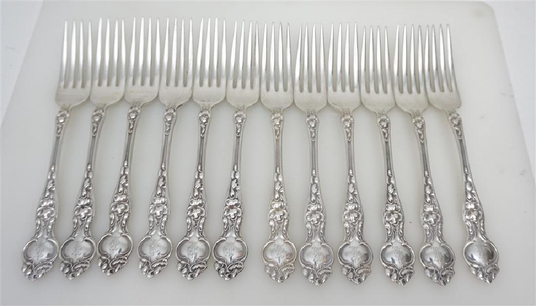 12 STERLING SILVER 1904 VIOLET DINNER FORKS: Twelve (12) Sterling Silver Wallace Silversmiths 1904 "Violet" Teaspoons designed by Henrik Hillbom. Each 7 1/4". Monogrammed, Good condition. Weight on all 500 grams. PROVENANCE: A Charleston SC Priv