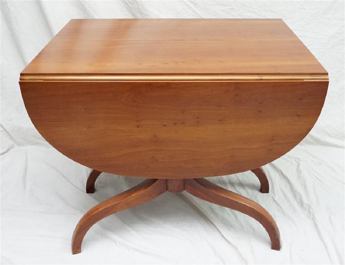 DUNCAN PHYFE STYLE TRIPLE PEDESTAL DINING TABLE: Duncan Phyfe Style Triple Pedestal Drop Leaf Dining Table. With Three Leaves. Without Leaves 29"x40"x30. Each rounded enf leaf 16" Each leaf 12". When assembled 97" long. Table pads included. Good con