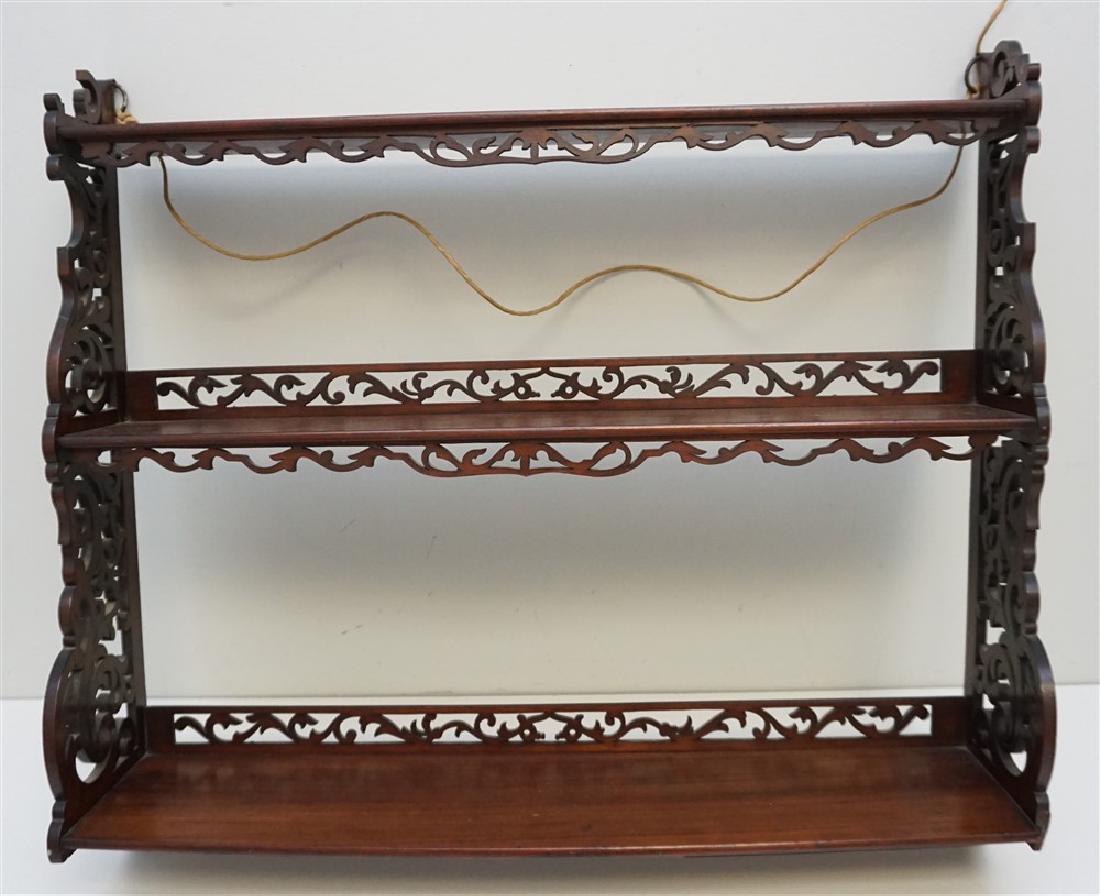 CARVED MAHOGANY 3 TIER WALL SHELF: Antique Carved Mahogany 3 Tier Wall Shelf. Minor age appropriate wear, split 1 side, scattered loss to fret. Measures 26"x6"x22". Weight 6 pds. PROVENANCE: A Private Charleston SC Estate.