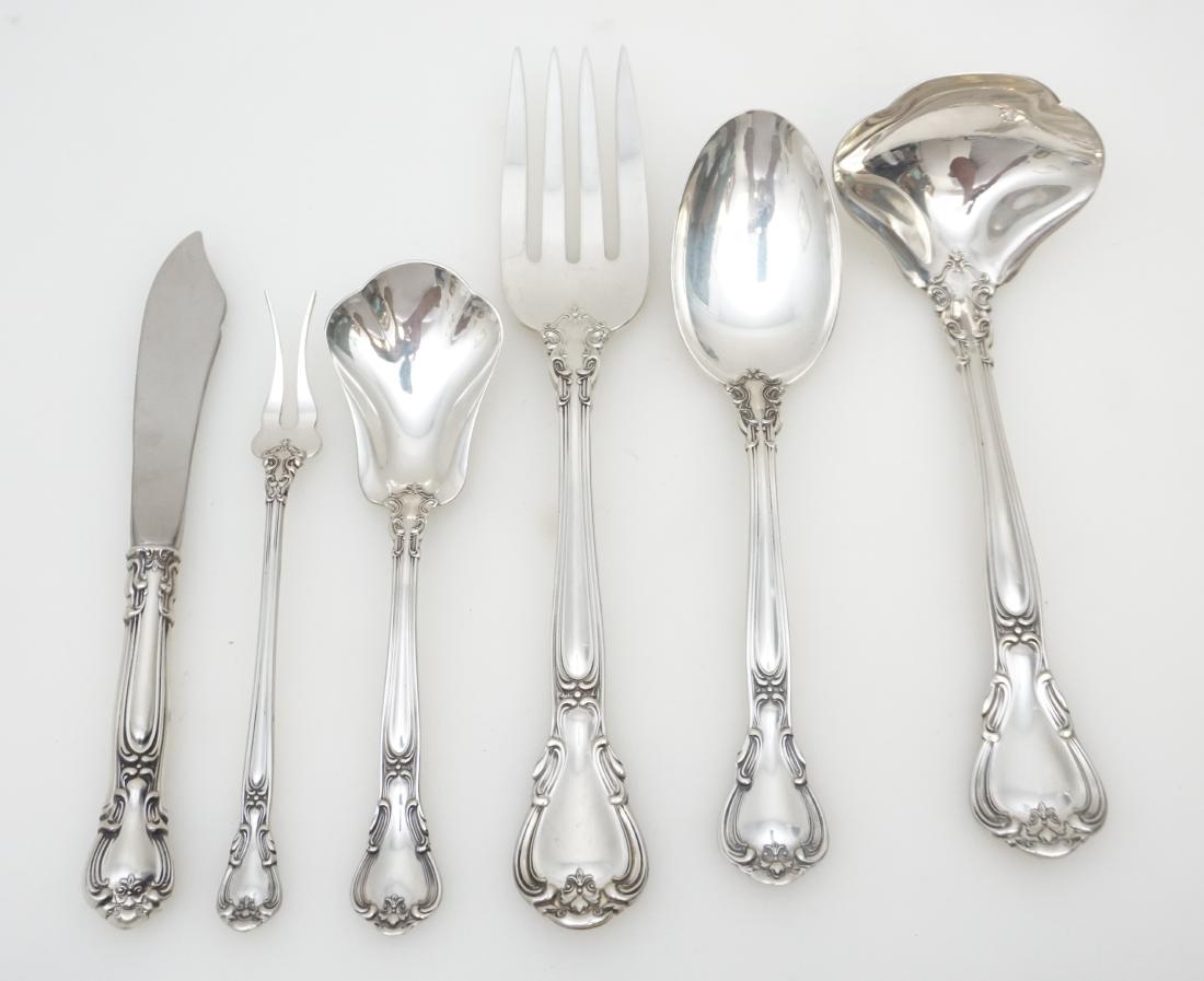 6 STERLING CHANTILLY SERVING PIECES: Six Sterling Silver Chantilly Serving Pieces by Gorham. All in excellent condition, no monograms. 1- Solid Gravy Ladle 6 3/4". 2- Pickle / Olive Fork 5 3/4". 3-Solid Serving Fork 8 1/2". 4- Master But