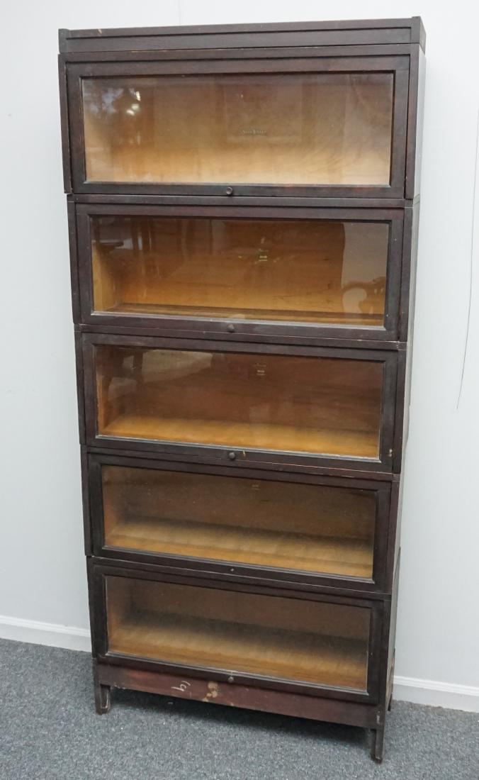 MACEY 5 STACK BARRISTER BOOKCASE: Tall Macey 5 Stack Arts & Crafts Era c. 1900-1910 Dark Oak Barrister Bookcase with base and top. Top unit is Shaw Walker. Measures 34"x12"x75". PROVENANCE: A Charleston SC Private Estate **Pickup only