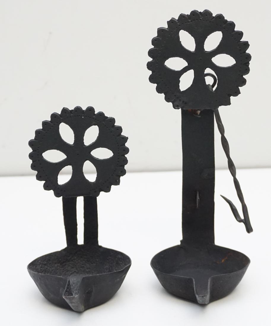 PA DUTCH 19TH c DOUBLE BETTY OIL LAMP: Antique late 18th / early 19th c fancy Pennsylvania Dutch hand wrought iron double betty / cruse lamp. Nested with rat tail twist iron hanger, 4 1 /4"x 2 3/4" x 10 1/4" hanging, with nice black patina
