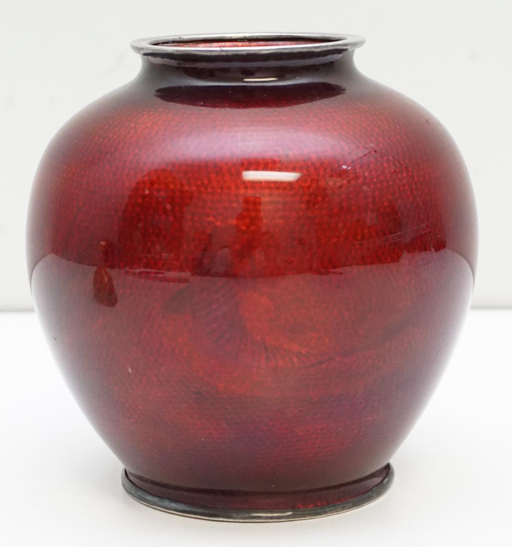 JAPANESE GINBARI CLOISONNE VASE: A turn of the century Meiji/Taisho period Japanese Ginbari Cloisonne vase, with a short neck above a bulbous body. Decorated with koi and seaweed under Red transparent glaze with Silver base and rim. 