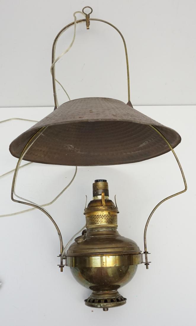 ANTIQUE BRASS CABIN LANTERN: Antique Brass Cabin Lantern that has been electrified. Original old tin shade. Measures 15 1/4"x15 1/4"x30. Weight 3 pds. PROVENANCE: A Private Charleston SC Estate.