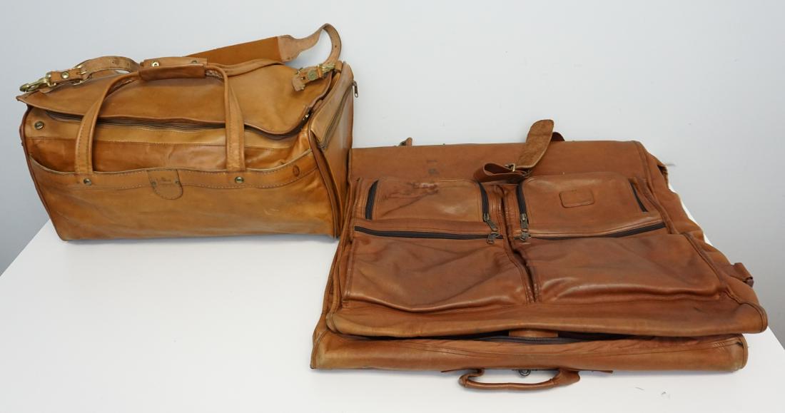 2 PC VINTAGE TUMI & HARTMANN LEATHER LUGGAGE: Vintage 2 Piece Tumi Leather Garment Bag and a Leather Hartmann Duffle. Duffle 20"x8"x8". Garment 23"x24". Weight on all 5 pds. Age expected wear. PROVENANCE: A Pawleys Island SC Private Estate