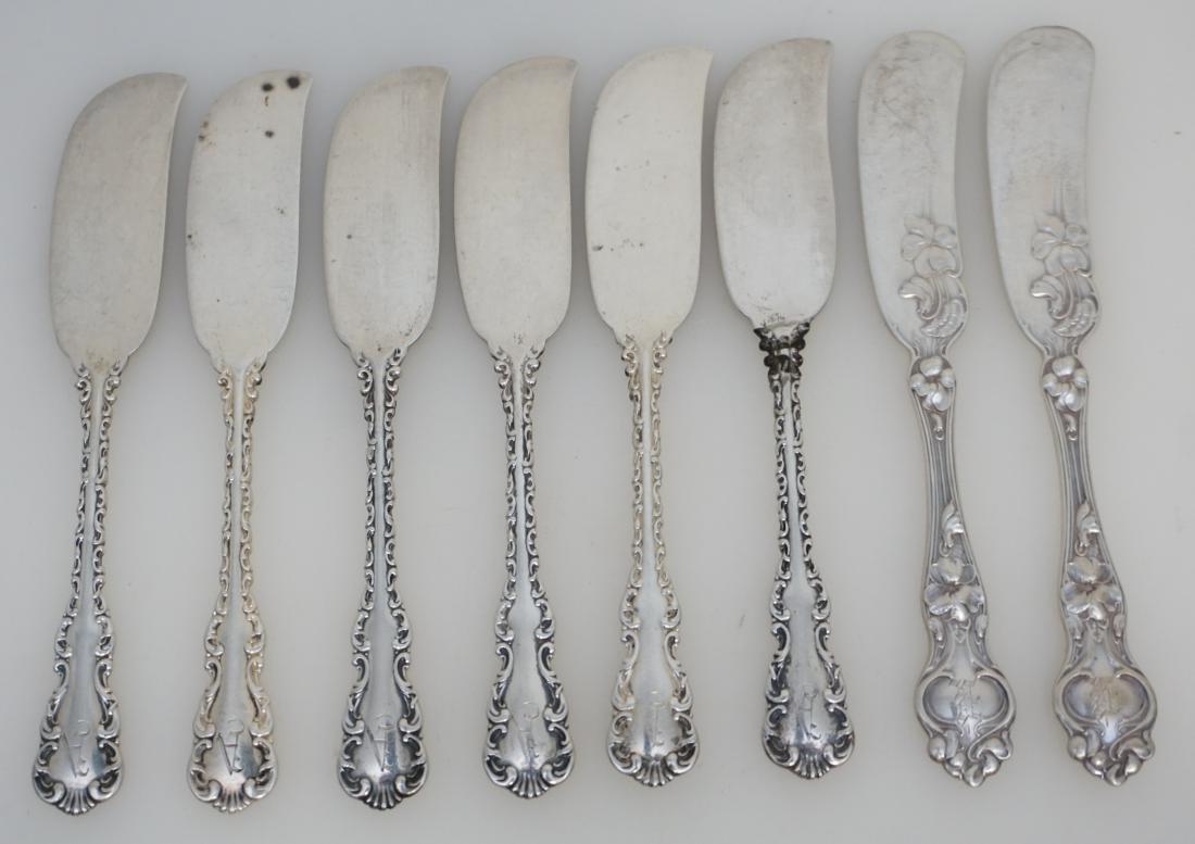 8 STERLING ANTIQUE BUTTER SPREADERS: Eight (8) American Antique Sterling Silver Butter Spreaders. All are monogrammed. 2 are Wallace Silversmiths 1904 Violet 5 1/8". 6 are Whiting Mfg. 1891. Louis XV 5 1/8". Weight on all 139 grams. PROV