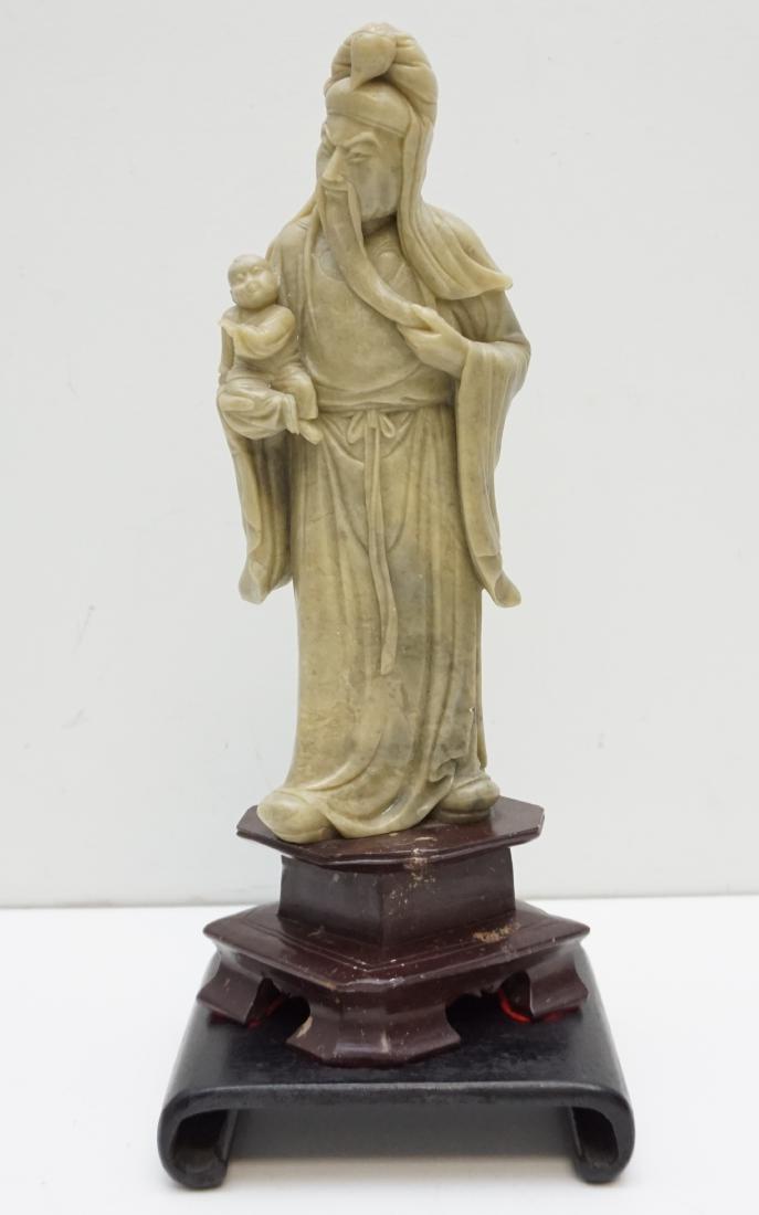 TALL STONE CARVED CHINESE FU FIGURE: Vintage Chinese detailed carved Soapstone Fu Figure with Child. Measures 14" tall. With additional wood stand 151/2". Weight 9 pds. Fu is the wise man that is often depicted holding either a scroll, o
