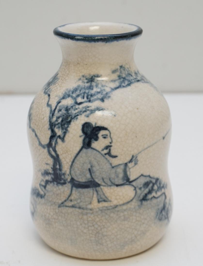 VIETNAMESE CERAMIC VASE 18/19TH c.: Antique Ceramic Vase, Northern Vietnam, 18th - 19th c. Blue and white decorated with tree and fisherman. Crazing. Measures 3.25"x3.25"x5.25". Weight is 15 oz. PROVENANCE: A Charleston SC Private Colle