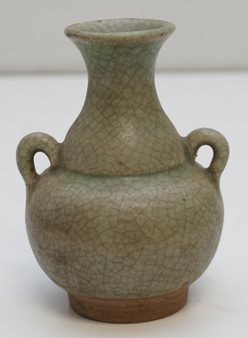 THAI SAWANKHALOK CELADON VASE / JAR: Small Antique Thai Sawankhalok Celadon Glazed Storage Jar / Vase, of globular-form with incised horizontal decoration at the top of the body by neck, a ridged flared lip with two strap handles and gla