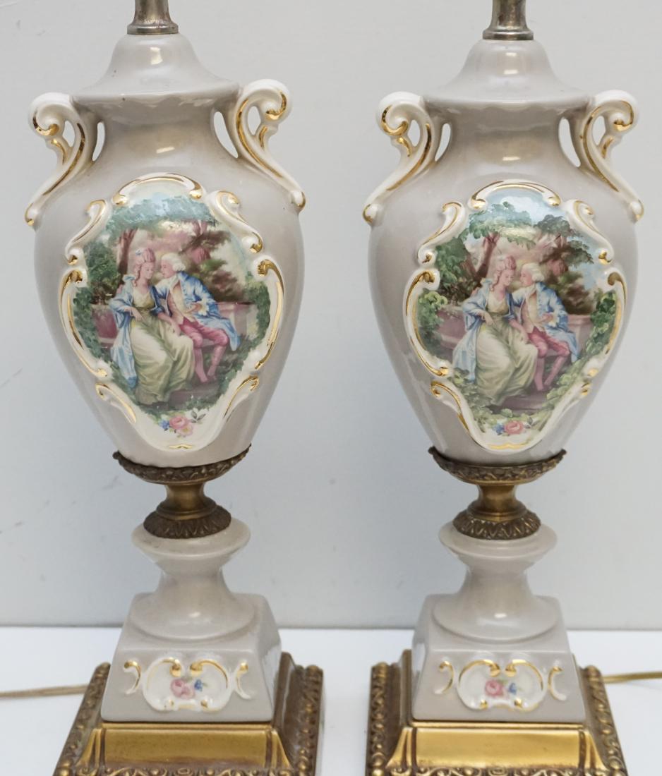 PAIR PORCELAIN TABLE LAMPS: Matched Pair Of Vintage Table Lamps. Taupe with Romantic Transfer Medallions accented with Gold. On attached Brass Bases. Lamps 18 3/4"and with harps 28". Weight 8 pds 11 oz. PROVENANCE: A Charleston