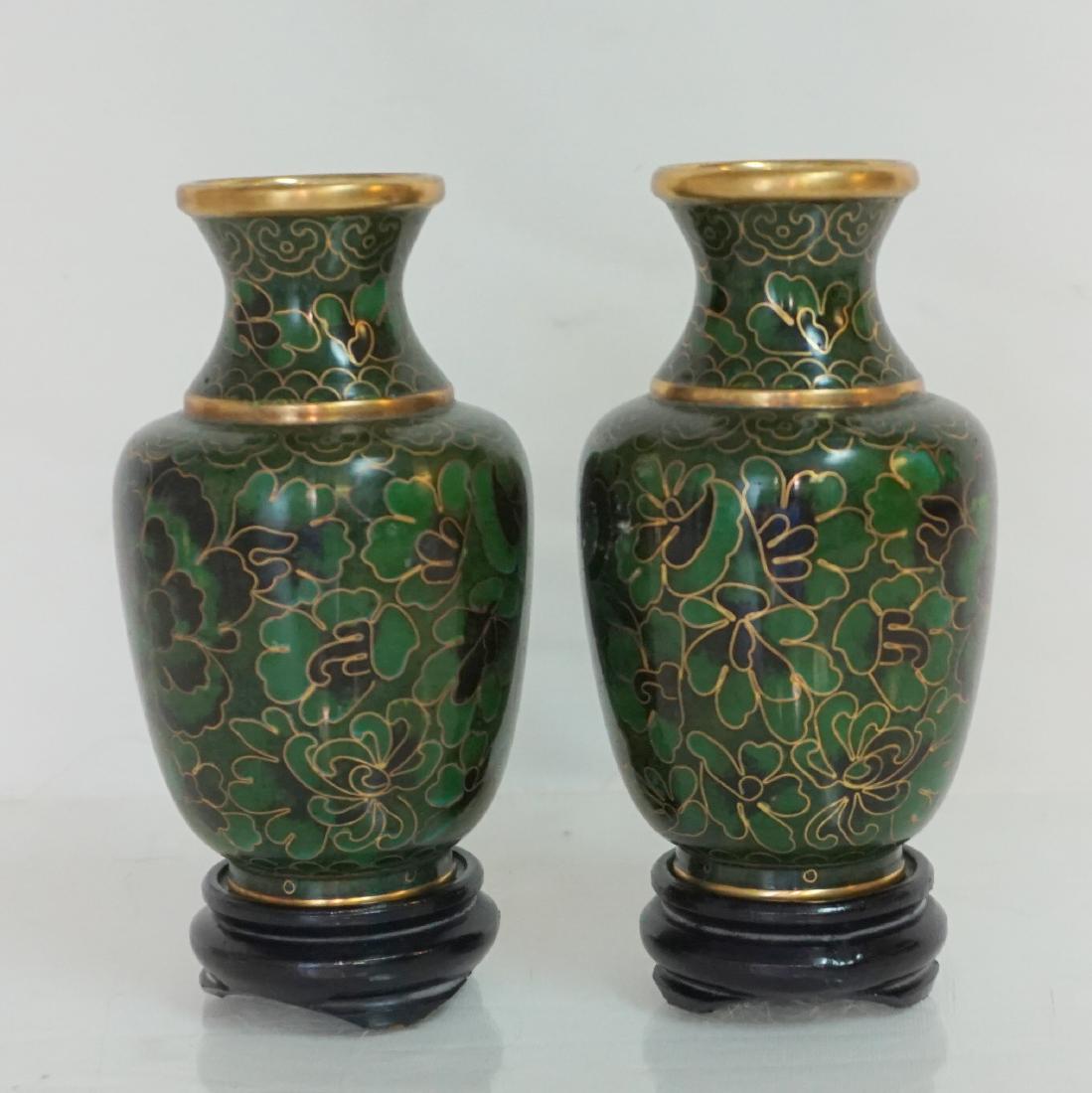 PAIR SMALL CHINESE CLOISONNE VASES: Matched Pair of Small Fine Chinese Cloisonne Enamel Vases. Green and Blue with gilding, ruyi necks and turquoise Bases. 4" tall. Both with carved wood ebony stands 4 3/4" on stands. Weight combined 10