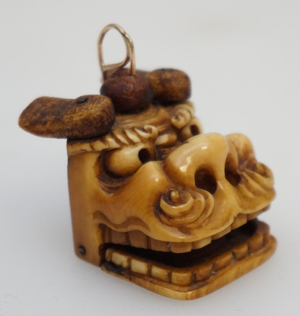 JAPANESE CARVED SHISHI ARTICULATED HEAD: Antique Japanese Carved Bone Articulated Shishi Head Netsuke. Signed. Measures 1"x1". PROVENANCE: A Private Charleston SC Estate