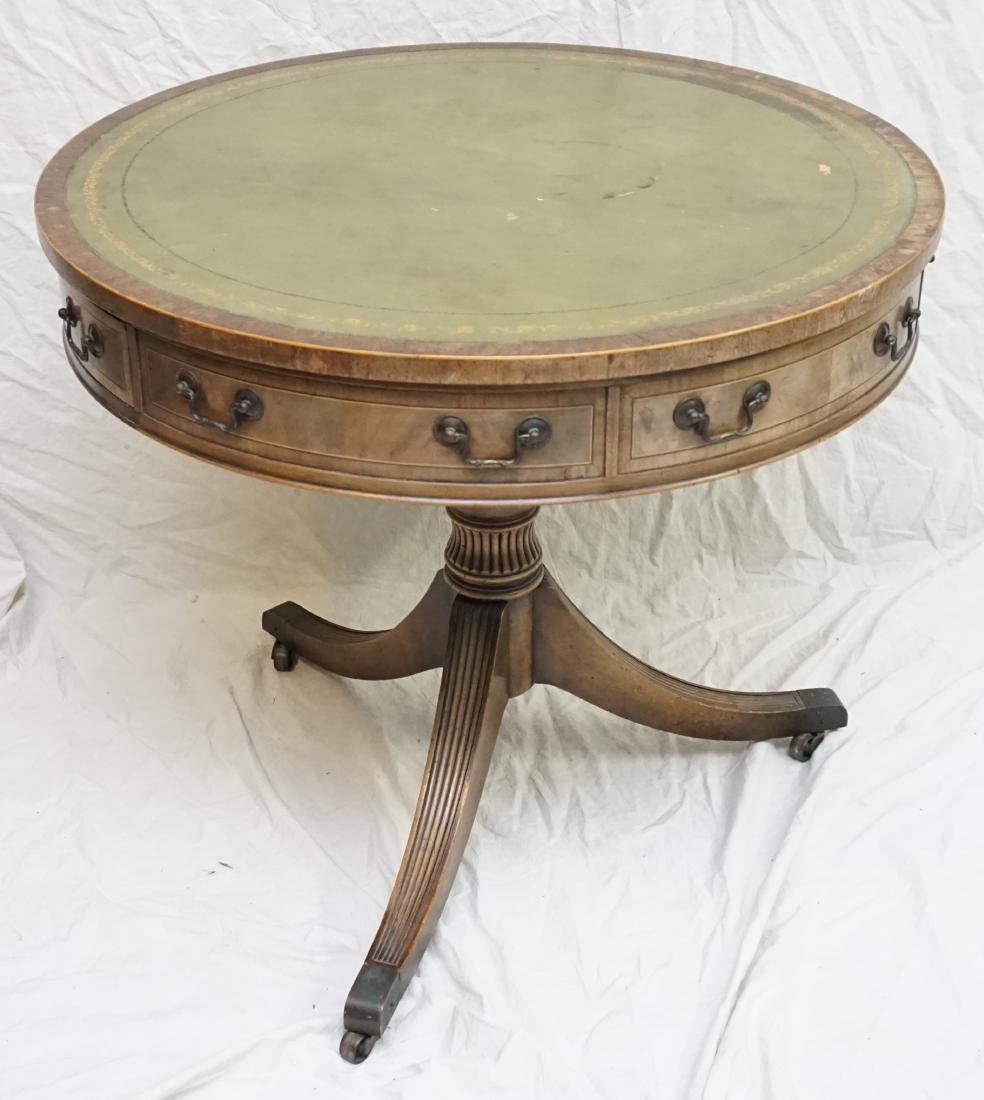 LEATHER TOP DRUM TABLE: Vintage c. 1920 Burl Mahogany Leather Top Drum Table. Sage green tooled leather top. Some wear to top, fading to wood.Measures 31.5 x 29" tall. PROVENANCE: A Private Charleston SC Estate. ***Pickup on
