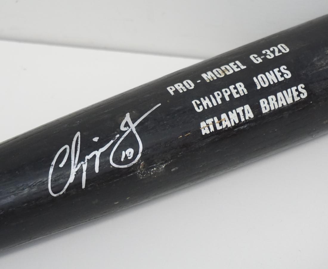 CHIPPER JONES ATLANTA BRAVES BAT: Chipper Jones Glomar Professional Model G-320 game used black bat signed by the Atlanta Braves slugger and Hall of Famer in perfect looking silver felt tip pen "Chipper Jones 10". The bat's length and