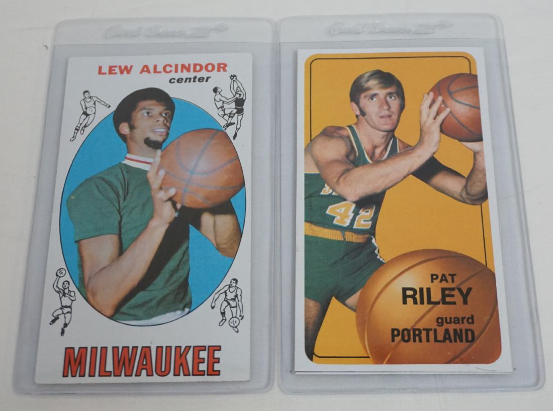 2 1969 LEW ALCINDOR & 1970 PAT RILEY: 1- Vintage 1969 Topps #25 Lew Alcindor (Kareem Abdul-Jabbar) 1st season card with the Milwaukee Bucks. Very good condition. 2- Vintage 1970 Topps #13 Pat Riley San Diego card. Very good condition. Pat