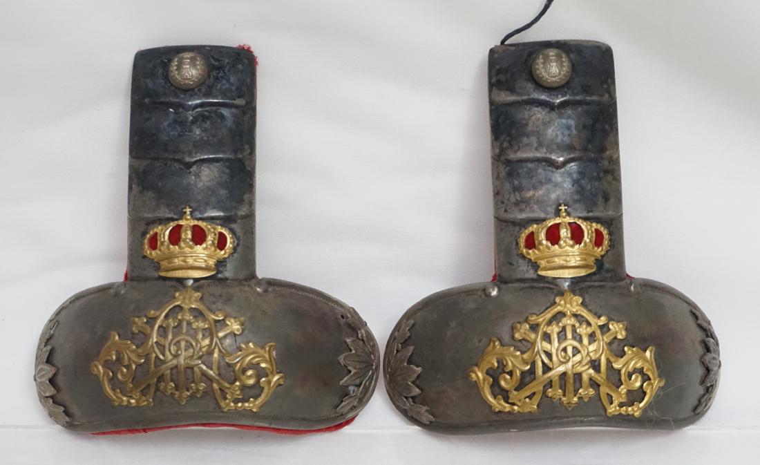 ANTIQUE SPANISH EPAULETTES: Pair of Antique Spanish Military Epaulettes. With an applied crown and the initials of King Alfonso XIII (1896-1931), lined with red velvet. En Verso Toledo Artillas. Each 5"x5 1/4". Weight combined 9