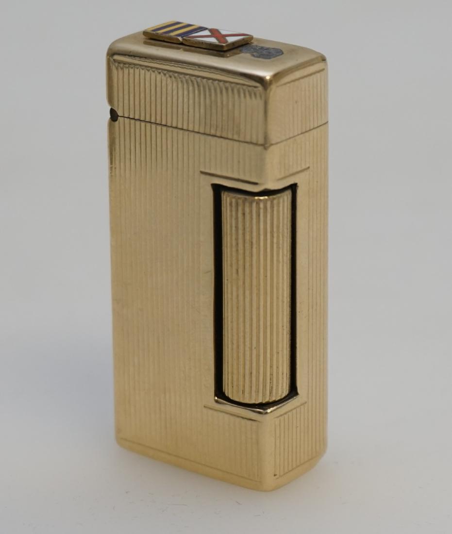 DUNHILL 14KT GOLD ROLLALITE LIGHTER: Mid Century Dunhill 14k Cased Rollalite Lighter. Stamped: 14K GOLD, U.S. PAT.2102108, OUTER JACKET, L&K 1208. Not tested, not working. 2 1/8". PROVENANCE: A Charleston SC Private Estate
