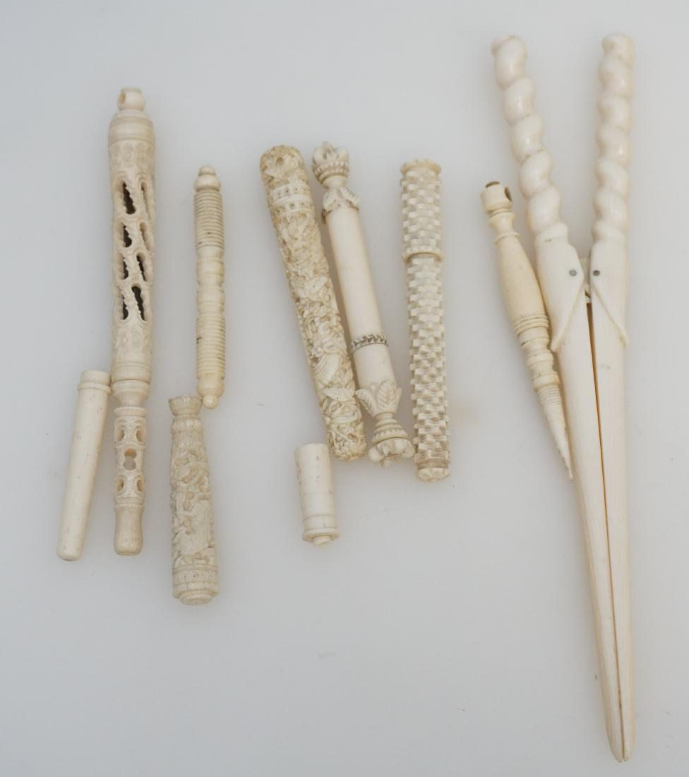 7 HAND CARVED BONE NEEDLE CASES + PEN: 1- 5 Antique Ornate Carved Bone Needle Cases. 2- Ornate Carved Bone Traveling Dip Ink Pen. 3- Celluloid Curling Clip 8". There are also 2 small pieces of bone needle cases that are missing tops. Weigh