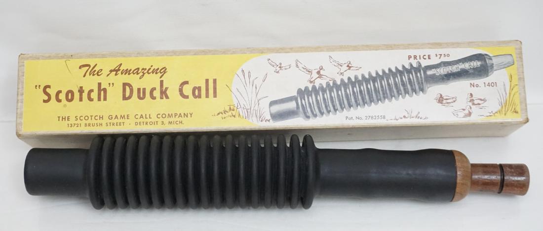 VINTAGE SCOTCH DUCK CALL IN BOX: The Amazing Scotch Duck Call by The Scotch Game Call Company in Original Box. In box measures 13"x2 1/4"x2". Weight 9 oz. In 1955 Max Harley applied for a patent on his new design duck call. He felt m