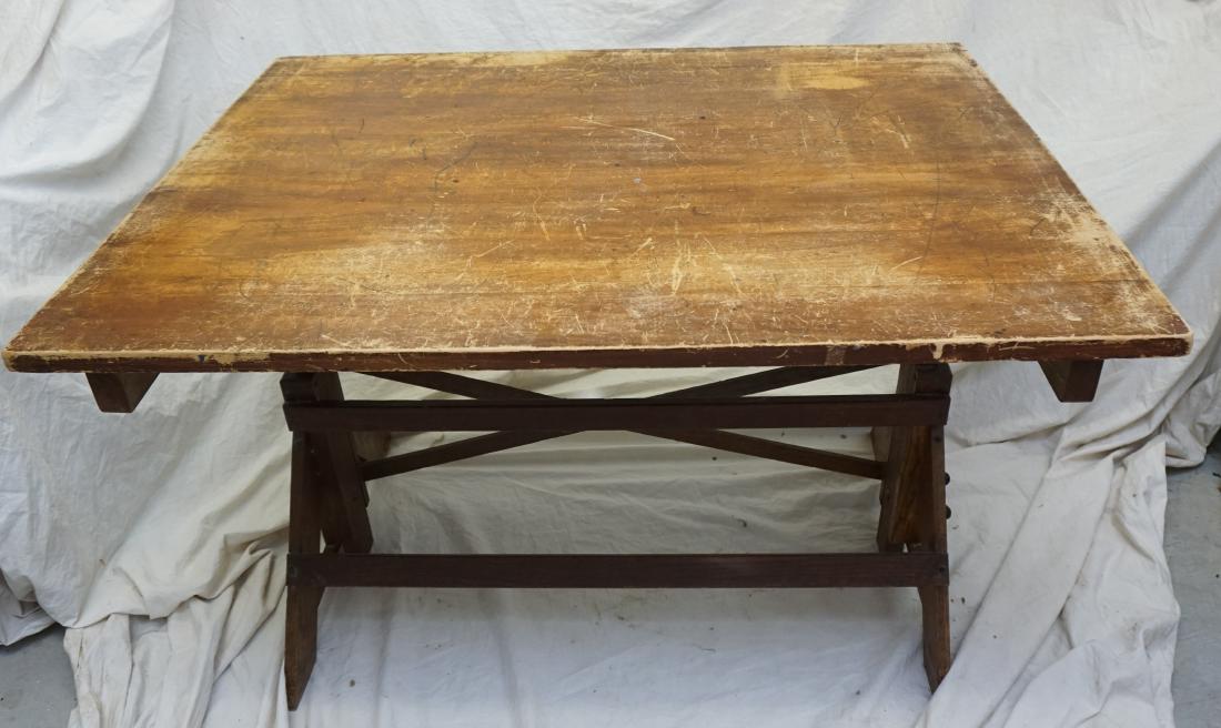 AMERICAN INDUSTRIAL DRAFTING TABLE: Vintage industrial c. 1920's adjustable drafting or draftsman table with a solid white oak base and maple top.The base consists of four angled (or a-frame) wood legs with cross-bracing and multiple bl