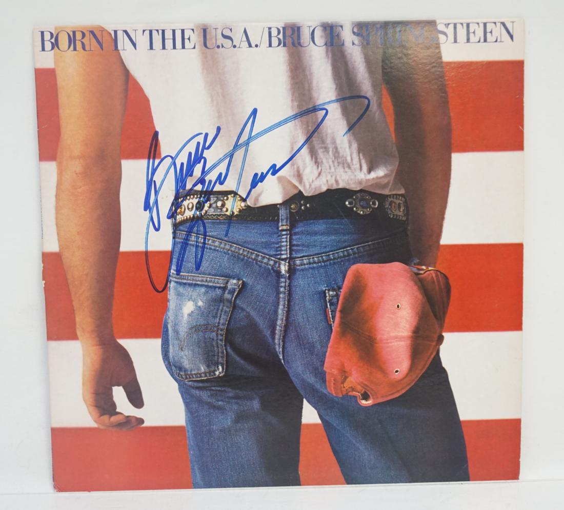 BRUCE SPRINGSTEEN AUTOGRAPHED BORN IN THE USA LP: Bruce Springsteen Autographed Born in the USA LP with COA. LP and cover in very good condition. Lifetime Guarantee of Authenticity from Piece of the Past. Measures 12 1/2"x12 1/2". Weight 10 oz/ PROVE