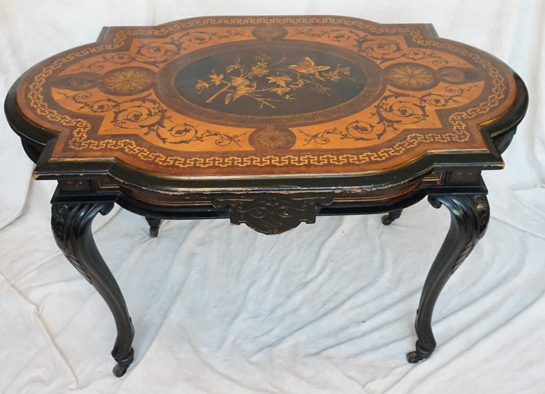 VICTORIAN INLAID EBONIZED + FRUITWOOD TABLE: Antique Victorian Eastlake Table. Ebony with Fruitwood Inlaid Top with Central Bird Medallion. Measures 49.5 x 31 x 30". PROVENANCE: A Private Charleston SC Estate.****Pickup only or Shipping on furni
