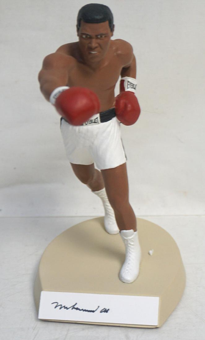 MUHAMMAD ALI AUTOGRAPHED BOXING STATUE: Muhammad Ali Autographed / Signed Salvino Boxing Statue. 8 1/2'' statue of "The Greatest" shows Ali in his boxing pose and has been signed by Ali in black ink. Statue rates Excellent. Limited edition 