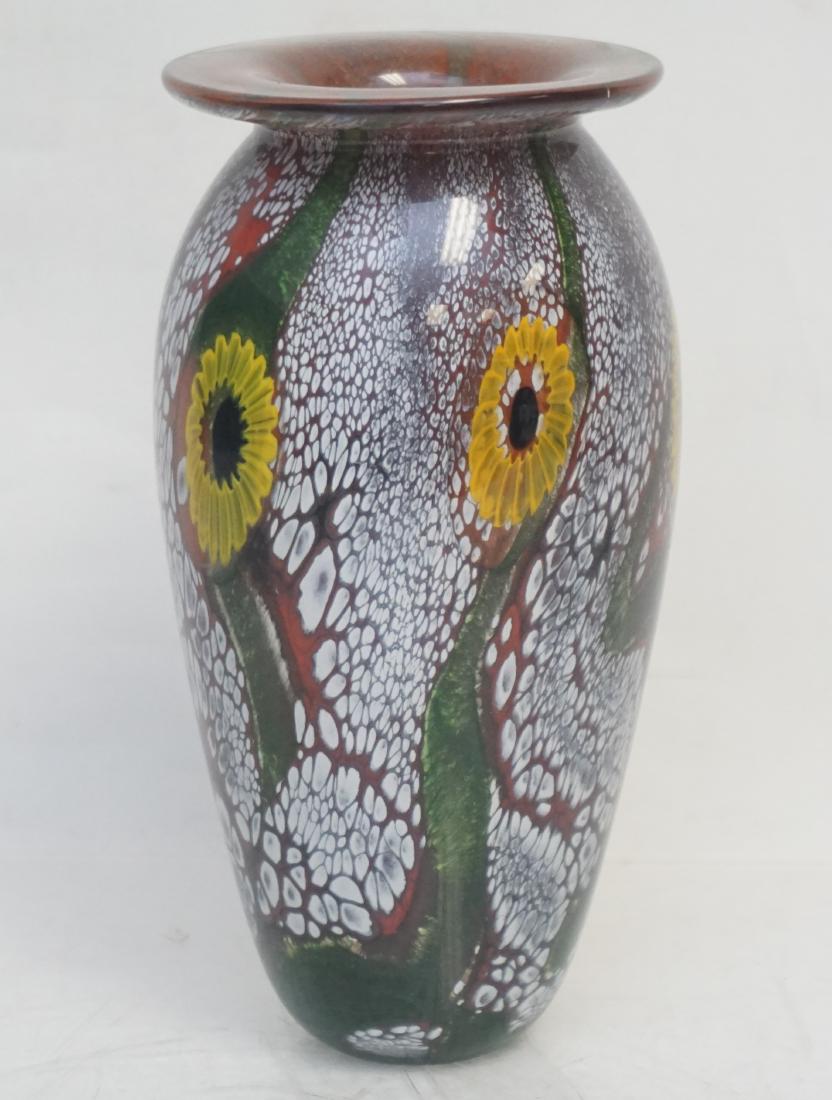ROBERT EICKHOLT ART GLASS VASE: Art glass vase by American glass maker Robert Eickholt features in red, green, and yellow hues. Embellished along the body with floral and vine motifs, signed along the underside "Eickholt 2001". Meas