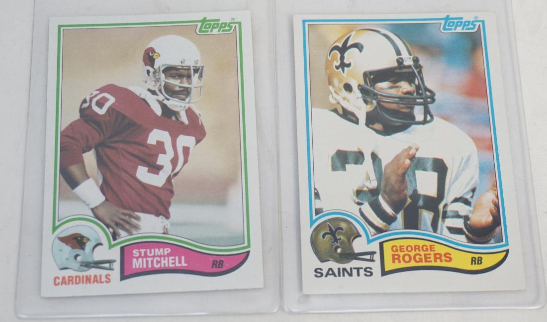 2 1982 TOPPS STUMP MITCHELL + GEORGE ROGERS: Both 1982 Topps, Carolina Colleges. Both in excellent condition. Both in sleeves. 1-1982 Topps Stump Mitchell #472 Cardinals, College - The Citadel. 2- 1982 Topps George Rogers Rookie Card #410 New Or