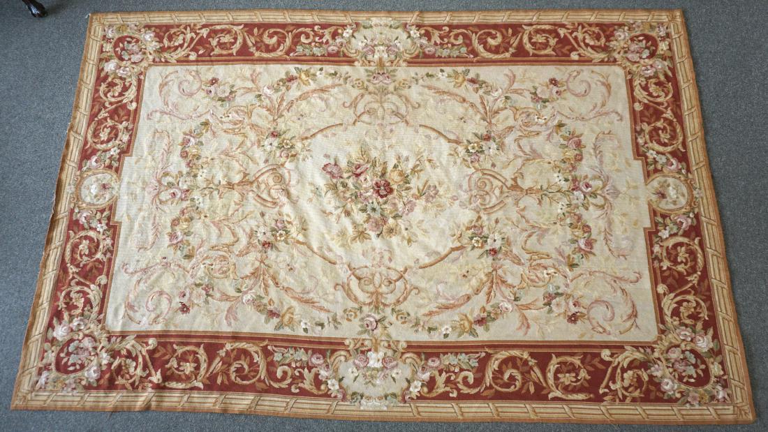FRENCH AUBUSSON RUG: French Aubusson Style Rug of woven wool, with floral pattern in shades of brown and cream accented with green. Good condition. Measures 64"x102". Weight 9 pds. PROVENANCE: A Private Charleston, SC Est