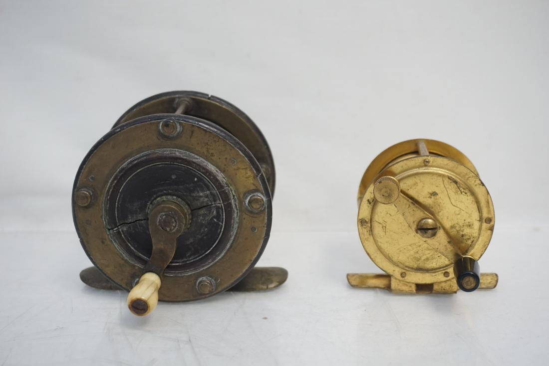 2 ANTIQUE CRANK WIND FISHING REELS: Two Antique Brass Crankwind Fly Fishing Reels. Larger one with bone handle c. 1890. Great additions to any reel collection. Weight 14 oz. PROVENANCE: A Private Charleston SC Estate.