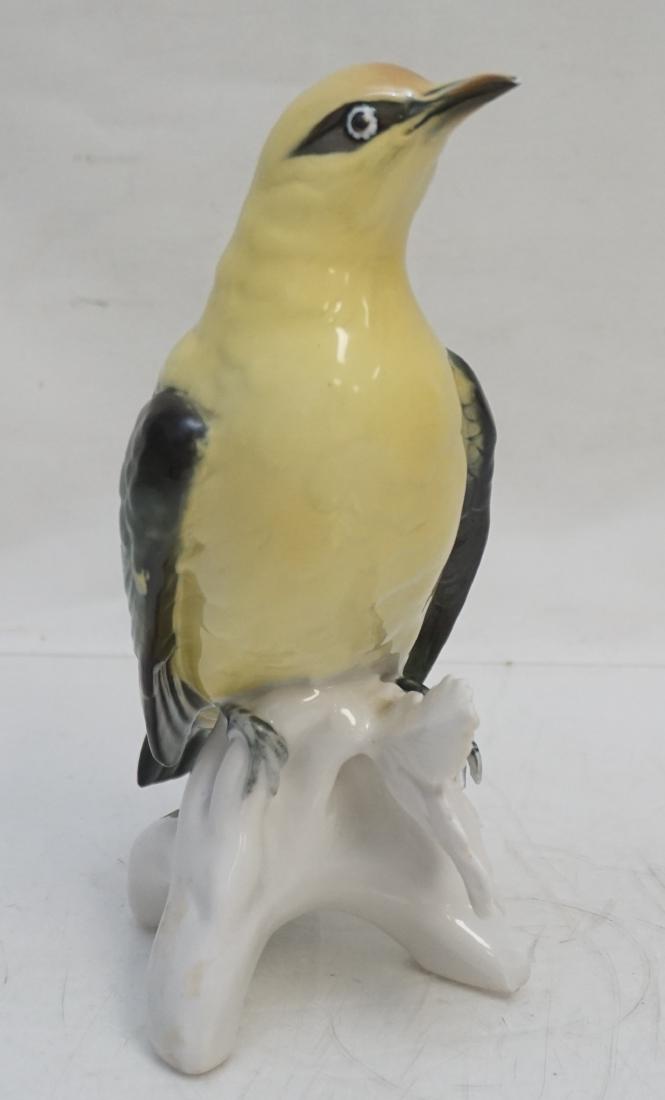 KARL ENS GERMAN PORCELAIN GOLDEN ORIOLE: Figural Golden Oriole on Branch from the German Firm of Porzellanfabrik Karl Ens, modelled in a very naturalistic fashion. In very good condition. Magnificent color and fine detail. Mark used is post