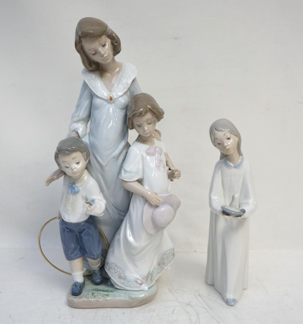 2 pc LLADRO SUNDAY BEST + GIRL WITH CANDLE: 1- Lladro Porcelain "Sunday Best" #5758. Figurine of a Mother, Daughter and Son stands 12". Issued in 1991 and retired in 1997. Girl is missing her floral bouquet, tiny nick to thumb. Measures 6"x5x12