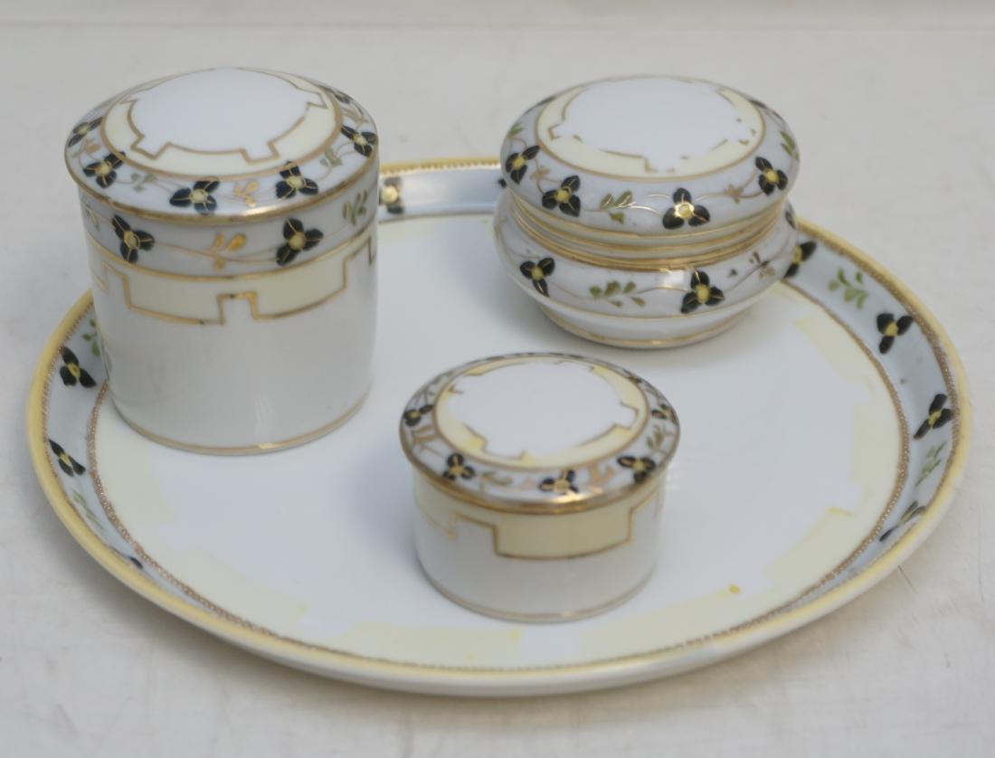 4 pc NIPPON DRESSER SET: Four Piece Hand Painted Nippon Porcelain Dresser Set. Tray and 3 jars. “M in Wreath”, M stands for Morimura Bros. (importers). Mark used since 1911. Found in green, blue, magenta, and gold colors.