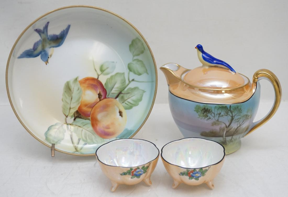 4 PIECE HAND PAINTED BLUE BIRD PORCELAIN: 4 Piece Hand Painted Morimura Noritake Porcelain Items. 1 Hand painted landscape Teapot with bluebird finale 5" tall. 1 Hand painted apple and bluebird bowl, 6 1/4" wide. 2 lusterware nut bowls / salt