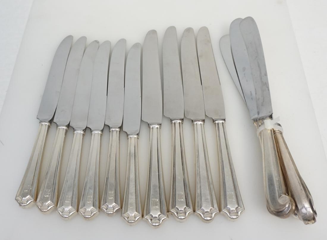14 STERLING DINNER KNIVES: 14 Vintage Sterling Silver Handle Dinner Knives. There are 10 by Manchester Silver 1910 "Mary Warren" monogrammed 8 3 /4" and 4 Gorham with Pistol Handles, 9 3/4". Weight on all 2 pds 5 oz.