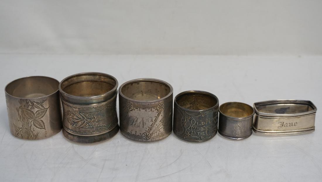 6 ANTIQUE SILVER NAPKIN RINGS: 6 Antique Silver Napkin Rings. 3 Sterling and 3 Silver Plated. Just sterling weight 105 grams. PROVENANCE: A Private Charleston SC Estate.