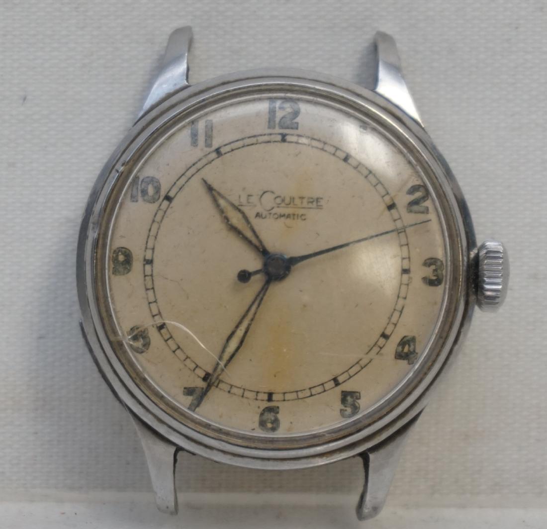 LECOULTRE AUTOMATIC STAINLESS STEEL WATCH: Early LeCoultre Automatic Manual Wind Stainless Steel Gents Wristwatch. Still runs but has a crack to crystal. With Oleg Cassini Strap. Weight on all 2.3 oz. PROVENANCE: A Private Charleston SC Estate