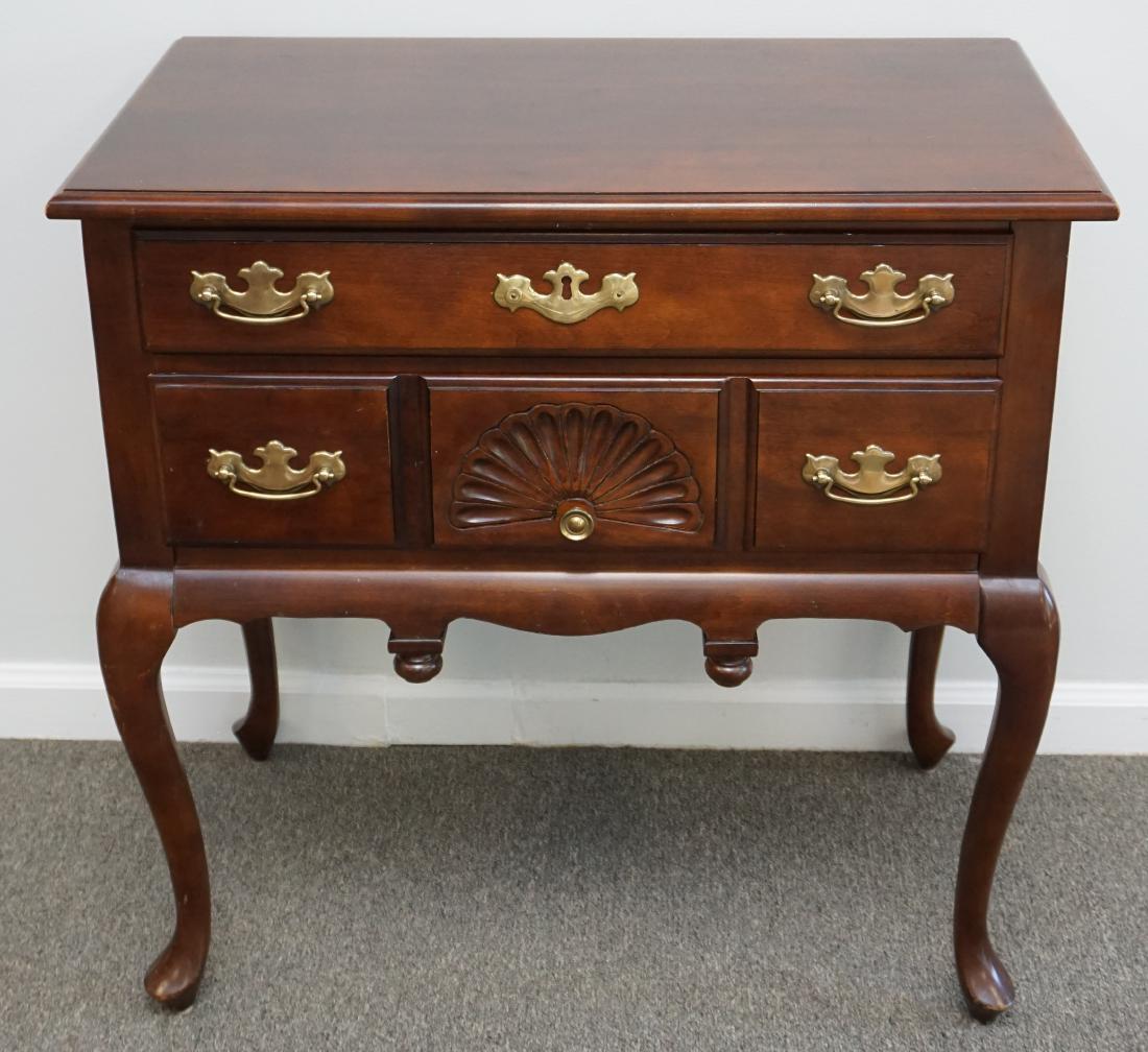 QUEEN ANNE CHERRY LOWBOY: A Queen Anne style lowboy by Hammary of North Carolina. This table features cherry construction with a rectangular tabletop. The table has two full-length drawer, each with brass swan neck handles aga
