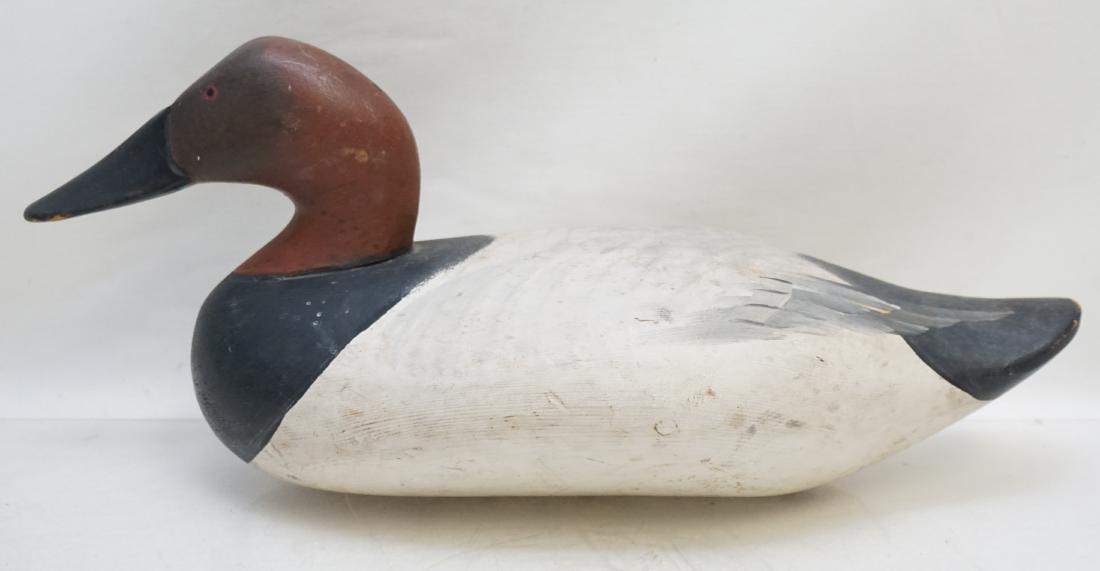 MADISON MITCHELL CANVASBACK DRAKE: Madison Mitchell (1901-1993) Havre de Grace Canvasback drake duck decoy dates from the second half of the 1900's. The solid wood decoy with painted eyes measures 16"x6"x7". Weight 2 pds 8 oz. PROVENAN