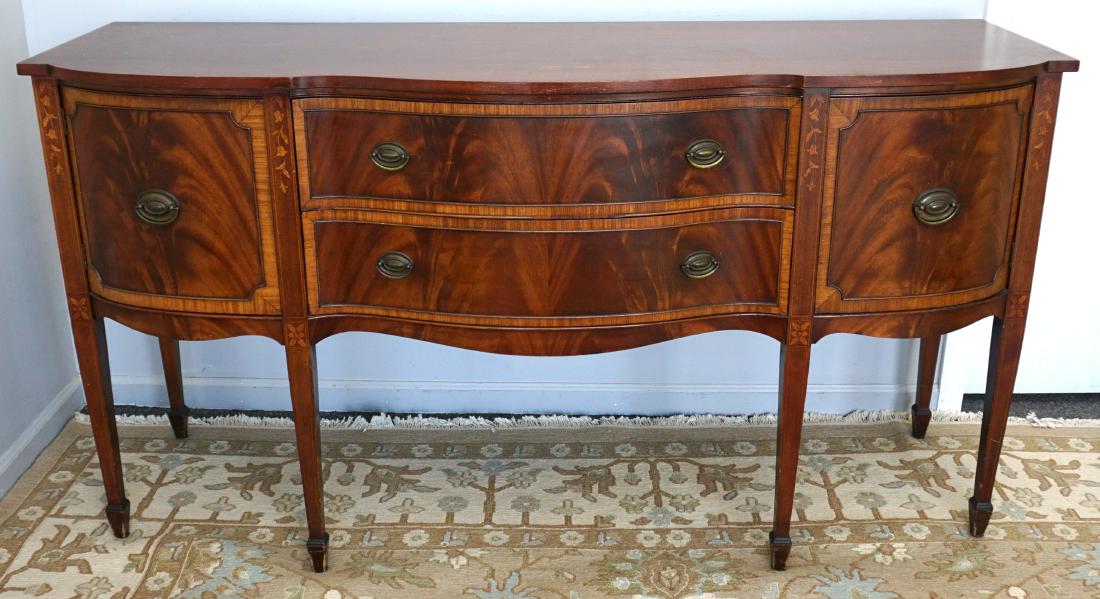 AMERICAN MAHOGANY INLAID SIDEBOARD: American Federal style mahogany sideboard first half 20th c. Inlaid and banded, flame mahogany serpentine front with two conforming central drawers flanked by two doors, tapered legs with string and b