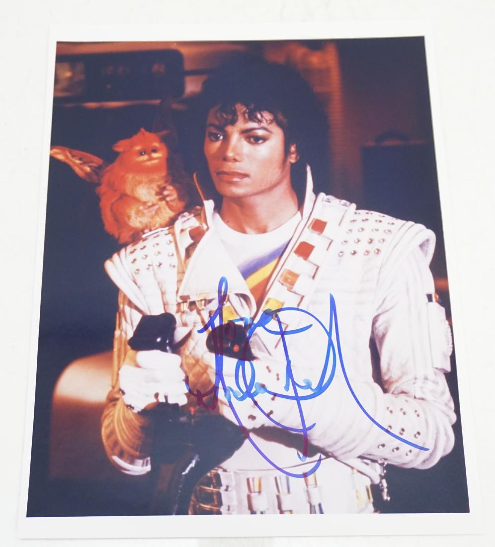 MICHAEL JACKSON AUTOGRAPHED PHOTO COA: Michael Jackson, 1986 in costume as Captain EO with small pet monkey puppet on one shoulder Autographed Photograph 8"x10" glossy. Signed in Blue Felt Tip Ink. With COA from Todd Mueller Autographs.