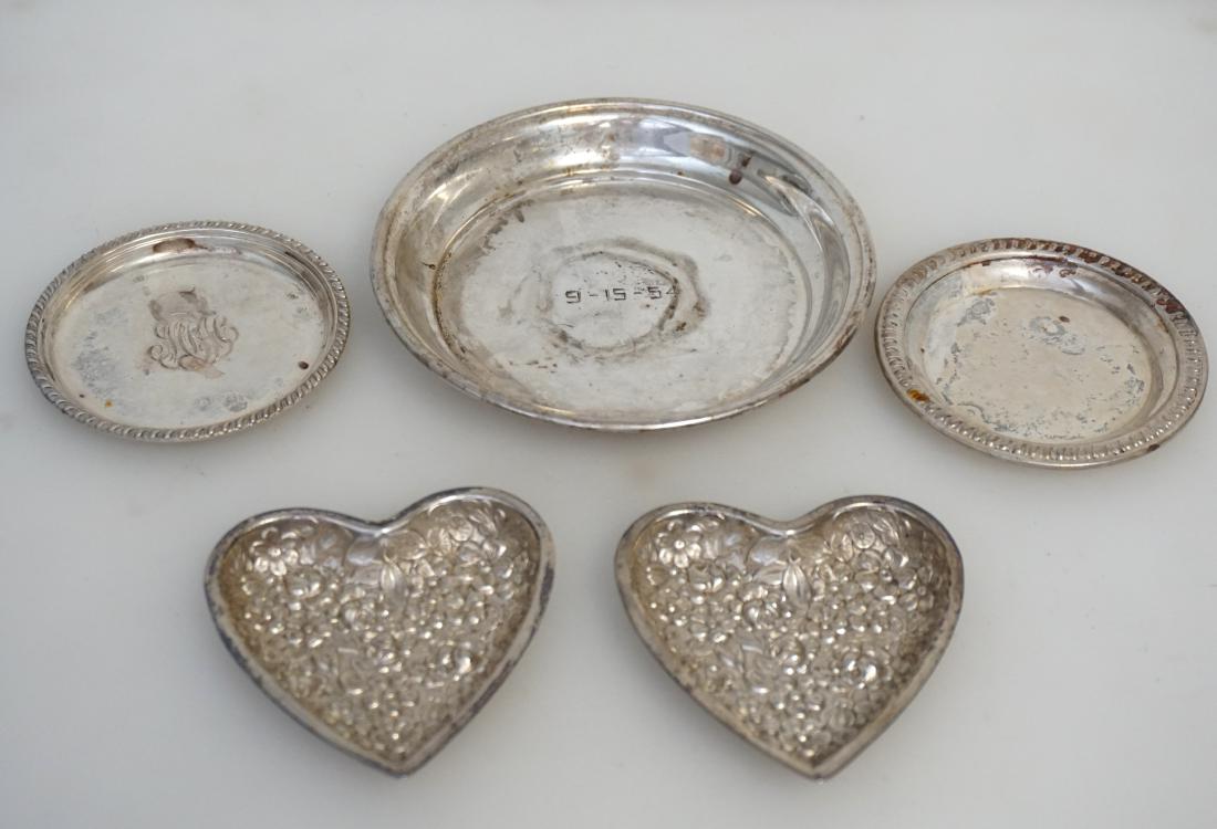 5 AMERICAN STERLING TRINKET / DISHES: All are Vintage American Sterling. Two Kirk Stieff Repousse Heart Trinket Dishes. In original pouches and boxes each heart 2 3/4", two Kirk Stieff small nut / mint dishes, Randahl Sterling Wine Coaste