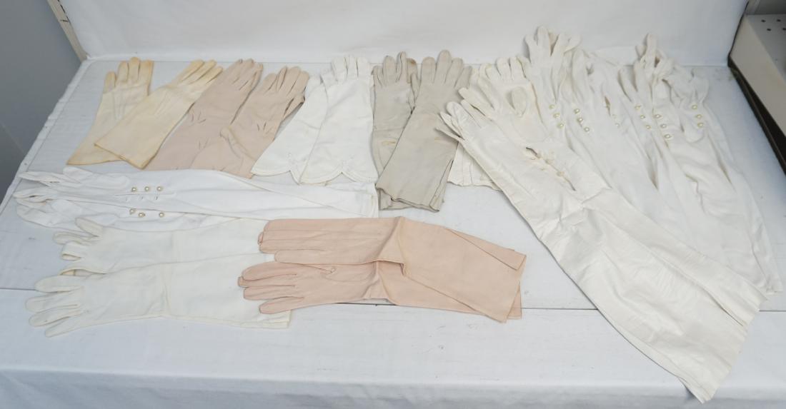 12 PAIR VINTAGE EVENING GLOVES: 12 Vintage Elbow Length Evening Gloves. 4 pair of kidskin including a pale pink pair. Weight 1 pd 2 oz. PROVENANCE: A Private Charleston SC Estate.