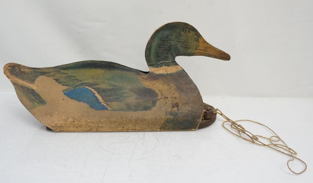 VINTAGE JOHNSONS FOLDING DECOY: Vintage Johnson's Folding Fiberboard duck decoy with wood base, great for display in a rustic home or cabin. The duck measures 16" long x 7 1/2" high. There ia a tear at the neck and age appropriate w